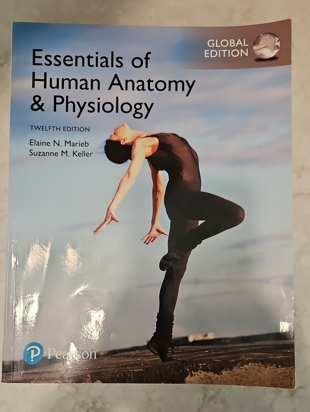 Textbook ~ Essentials of Human Anatomy & Physiology.